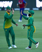 David Miller and ODI captain Temba Bavuma celebrate the fall of a wicket in previous action.