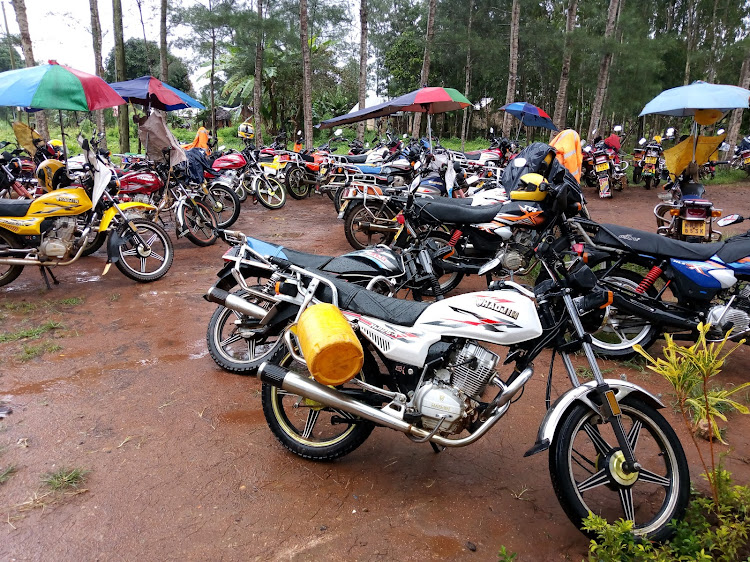 Motorbikes parked as riders wait for rain to subside in Matuga, Kwale county.