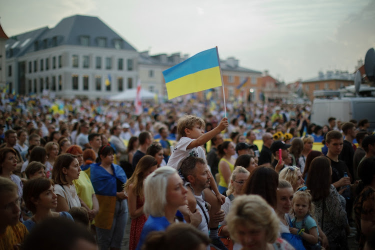 People take part in a demonstration to mark Ukraine's Independence Day, as Russia's invasion of Ukraine continues, in the Old Town in Warsaw, Poland, August 24 2022. Picture: DAWID ZUCHOWICZ/AGENCJA WYBORCZA.PL/REUTERS