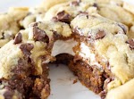 Giant S’mores Stuffed Chocolate Chip Cookies was pinched from <a href="http://www.smells-like-home.com/2012/05/giant-smores-stuffed-chocolate-chip-cookies/" target="_blank">www.smells-like-home.com.</a>