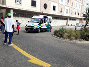 An ambulance was stationed on the grounds of the basic education department in Tshwane on Monday, with an eyewitness saying that a staff member was assaulted and needed medical treatment.