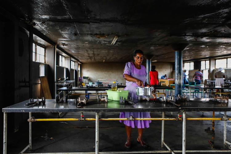 The communal kitchen at Madala Hostel in Alexandra is kept clean with gas stoves working and burning constantly. Pictured on 01 March 2016.