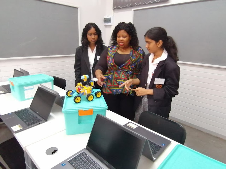 Mountview pupils and teacher Xoli Mahlangu play in the newly launched robotics lab at their school in Verulam, north of Durban.