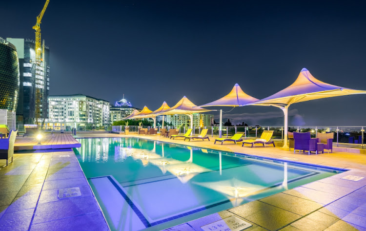 The pool bar lights up at night.