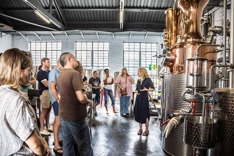 Time Anchor Distillery owner Shanna-Rae Wilby takes a tour group through the distillery.