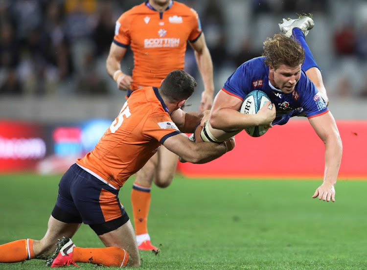 Stormers No 8 Evan Roos was very much in the thick of things against Edinburgh in their URC quarterfinal in Cape Town. Here Emiliano Boffelli tries to bring him down.