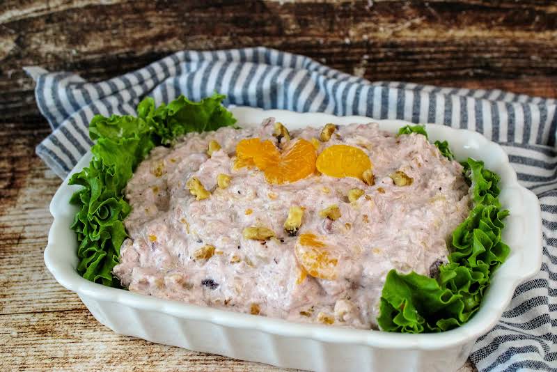 A Serving Bowl Of Cranberry Rice Salad.