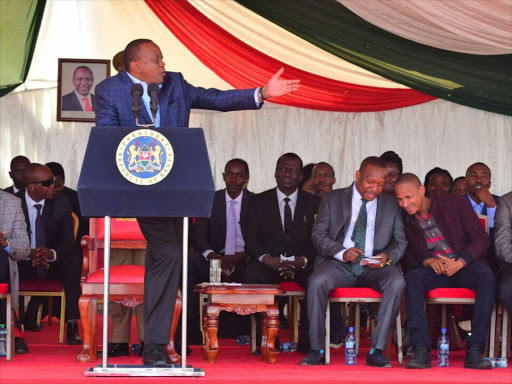 Governor Mike Sonko and Embakasi East MP Babu Owino in a chit-chat as President Uhuru Kenyatta addresses wananchi at the Jacaranda Grounds, Embakasi East on Wednesday, May 30, 2018. /COURTESY