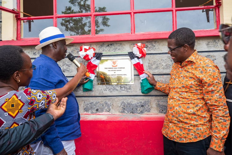 Azimio la Umoja One Kenya Alliance leader Raila Odinga with National Assembly Minority Leader Opiy Wandayi during the unveiling of a new dining hall at Mama Ida Odinga Secondary School in Ugunja Constituency, Siaya County on July 3,2023.