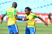 Mamelodi Sundowns star forward Percy Tau (R) celebrates with teammate Anthony Laffor after a scoring a goal.  