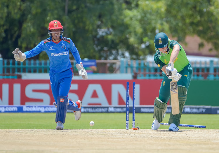 Gerald Coetzee of South Africa U 19 bowled by Shafiqullah Ghafari of Afganistan U 19 and Mohammad Ishaq Shirzad(W/K) celebrating the wicket during the 2020 ICC U19 World Cup game between South Africa and Afghanistan at Diamond Oval in Kimberberley on 17 January 2020.