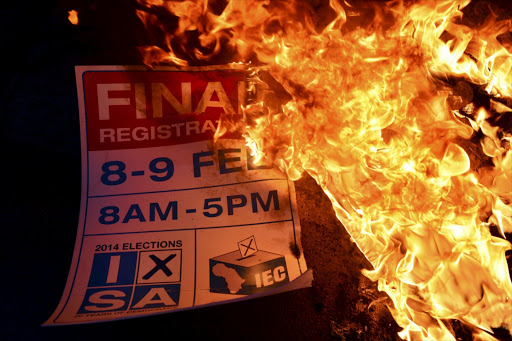 An election poster on fire on February 7, 2014, in Ekangala, South Africa. File photo.