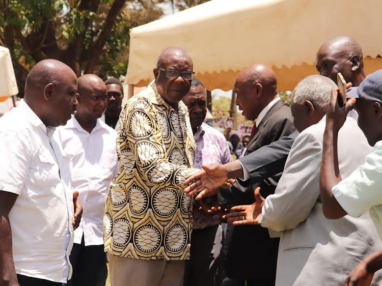 Former Vihiga Governor Moses Akaranga with elders in Sabatia