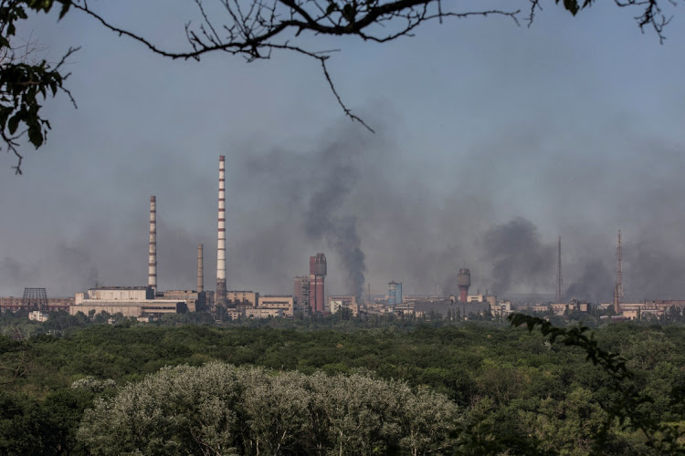 Smoke rises after a military strike on a compound of Sievierodonetsk's Azot Chemical Plant, amid Russia's attack on Ukraine, in the town of Lysychansk, Luhansk region, Ukraine on June 10 2022. Picture: REUTERS/OLEKSANDR RATUSHNIAK