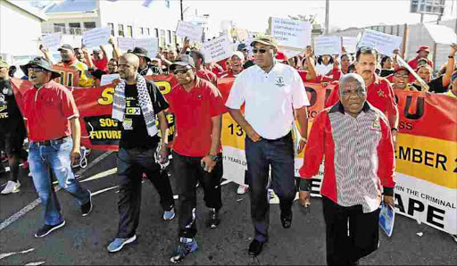 MAKING THEIR VOICE HEARD: Prison guards affiliated to Popcru downed tools yesterday over wages, promotions and working conditions. The march started in Southernwood to the correctional services regional offices in Quigney where they handed over a memorandum Picture: STEPHANIE LLOYD