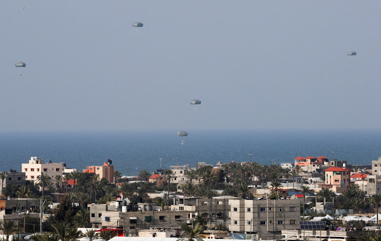 Aid is air-dropped in Rafah, the southern Gaza Strip, February 26 2024. Picture: IBRAHEEM ABU MUSTAFA/REUTERS