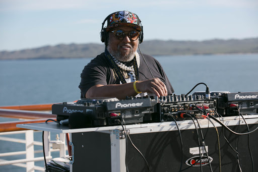 DJ on the aft deck.jpg - A DJ revved up the afternoon party on the aft deck of Westerdam.