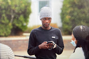 Stellenbosch University first-year student Babalo Ndwayana arrives at the Western Cape town's police station to lay charges on May 17 2022.