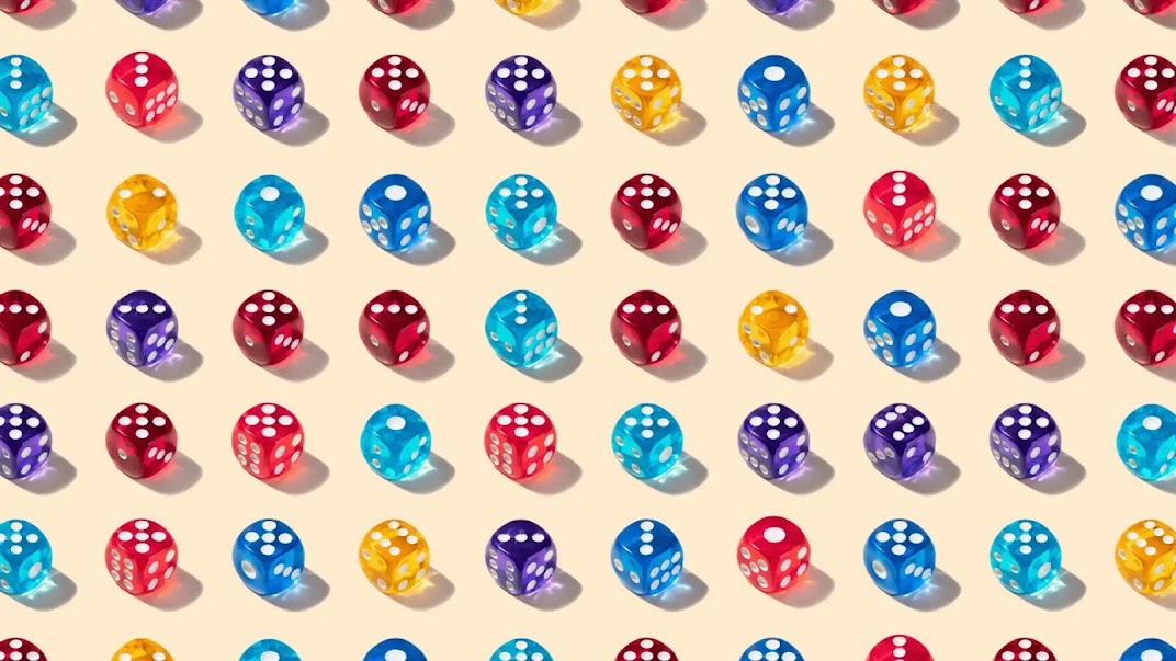 On a yellow background, there are neat rows of dice. They are different colours and showing different numbers