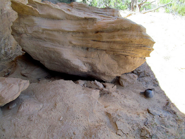 The pot's location in a shallow overhang