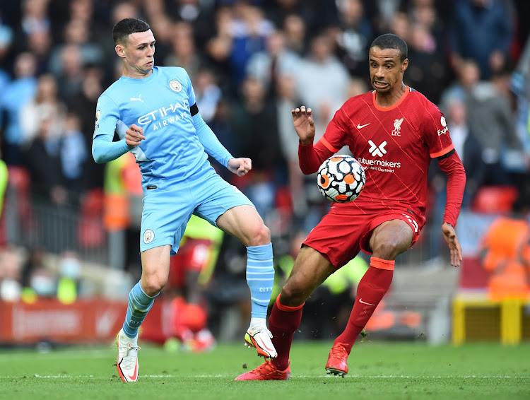 Manchester City's Phil Foden in action with Liverpool's Fabinho in a past match