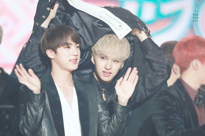 Ken and Jin under a jacket