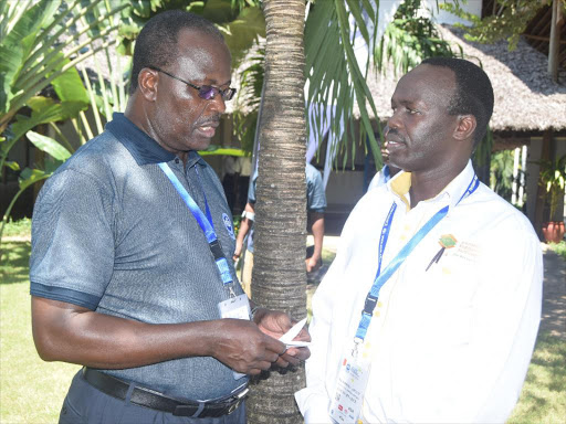 Association of Insurers and Brokers of Kenya chairman Nelson Omolo with Insurance Regulatory Authority acting CEO and Commissioner Godfrey Kiptum /CHARLES MGHENYI