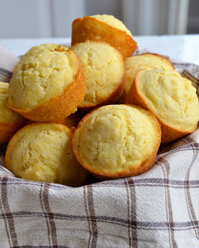 An easy Corn Muffin Recipe with crisp edges and tender moist centers made with simple pantry ingredients in less than thirty minutes. 