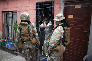 SANDF members patrol the streets in Alexandra during the lockdown. 