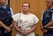 Brenton Tarrant, charged for murder in relation to the mosque attacks, is seen in the dock during his appearance in the Christchurch District Court, New Zealand March 16, 2019. 
