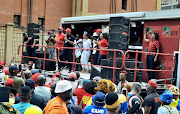 EFF leader Julius Malema addresses supporters outside the Pretoria offices of sports minister Nathi Mthethwa on Thursday.  