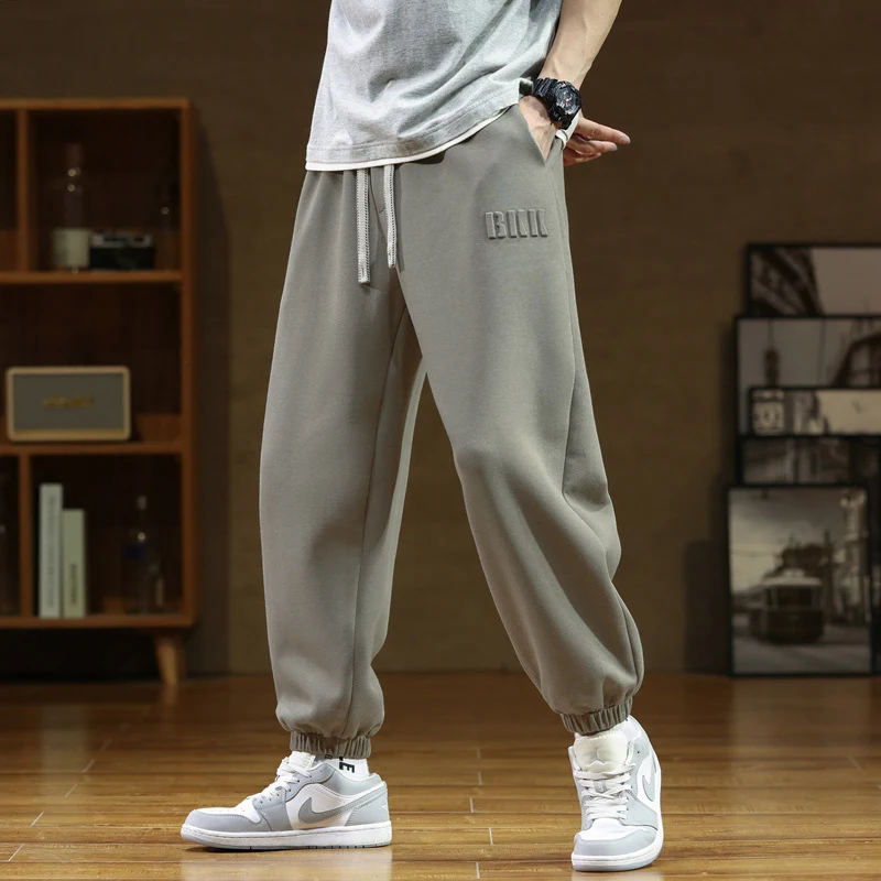Pantalones de chándal holgados de color liso para hombre, informales y modernos, comodidad y estilo para un look relajado y a la moda.
