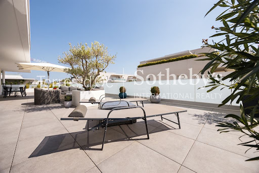 Modern terrace with outdoor furniture and olive tree in this luxury property for sale in Narbonne ($573,304 - 94 m²)