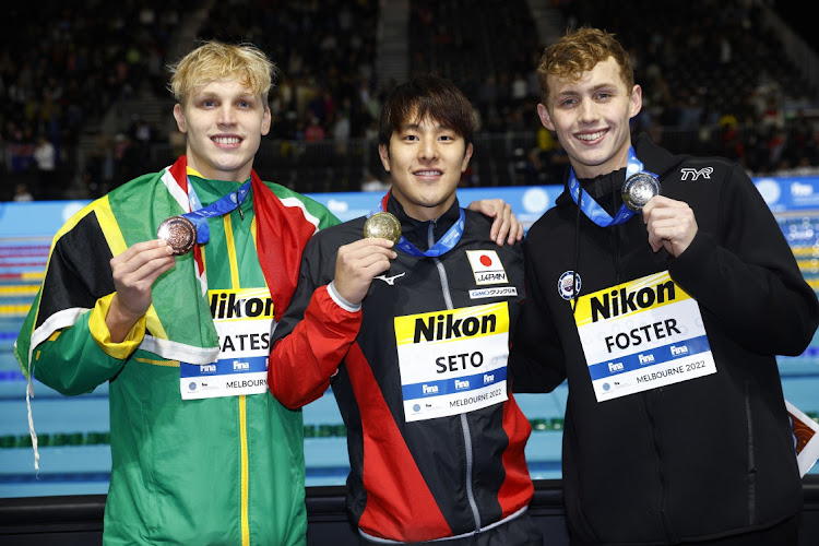 Matthew Sates, left, poses with his 400m individual medley bronze medal alongside Daiya Seto of Japan and American silver medallist Carson Foster in Melbourne.