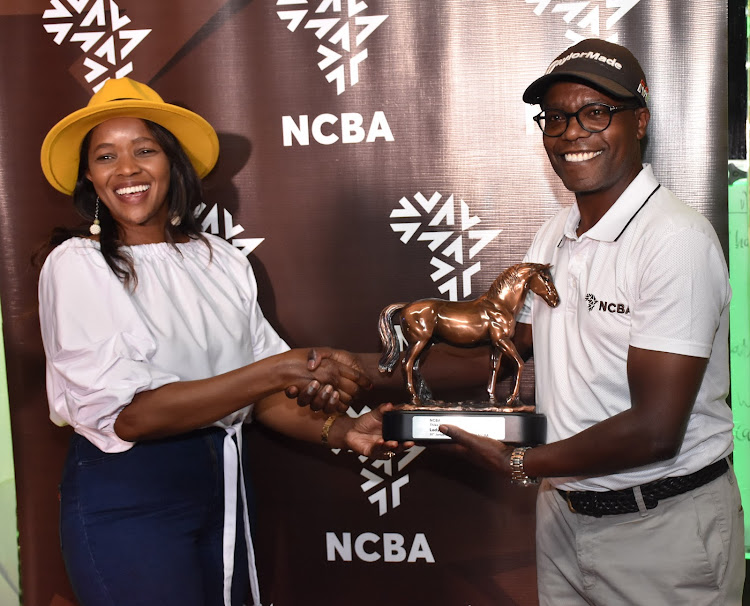 Lucy Maina (Ladies' winner) with NCBA MD John Gachara at the Thika Sports Club during the NCBA Series earlier this year.