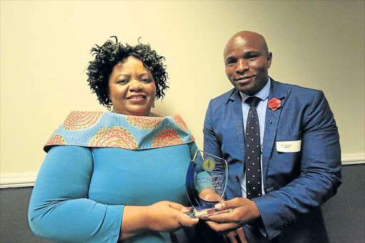 GOOD WORK: Dr Sibongile Mandondo, left, receives the local hero award from the South African Medical Association branch head, Dr Mzulungile Nodikida Picture: SINO MAJANGAZA