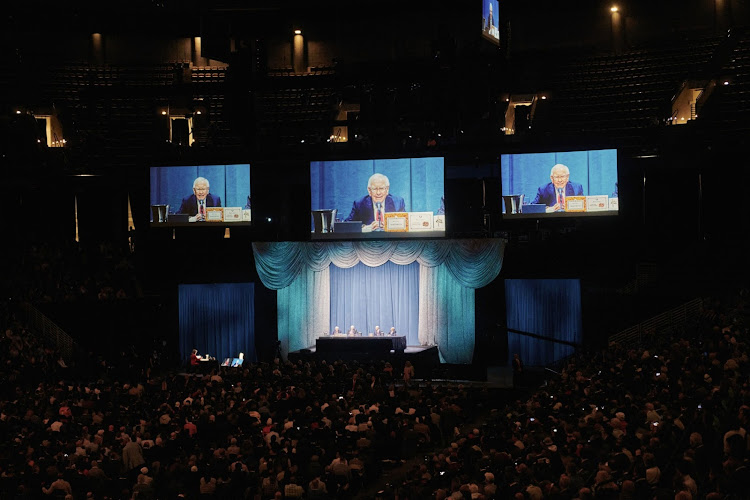 Warren Buffett is seen on screens during a Berkshire Hathaway annual meeting in Omaha, Nebraska, the US. Picture: BLOOMBERG/DAN BROUILLETTE