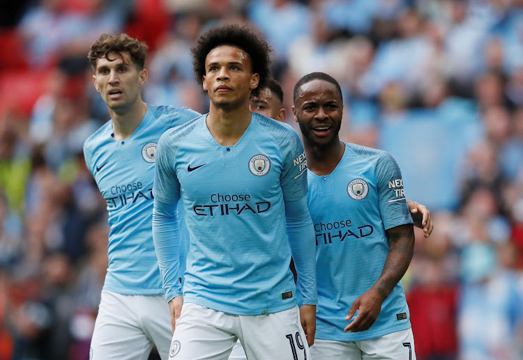 Manchester City's Leroy Sane with Raheem Sterling and John Stones during a recent match