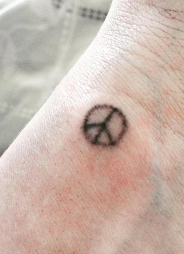 Tiny peace tattoo Design