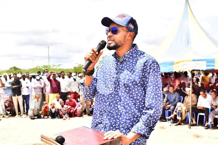 Senator Abdul Haji speaking at Masalani stadium on Monday during a peace meeting