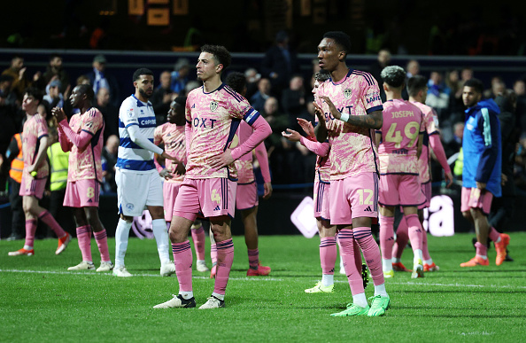 Ethan Ampadu and Jaidon Anthony of Leeds United look dejected following the team's defeat to Queens Park Rangers in the Sky Bet Championship at Loftus Road to hand the league title to Leicester City.