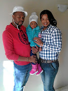 Sbusiso, left,  and Sabelo Makhanya and their beautiful daughter, Ndalo