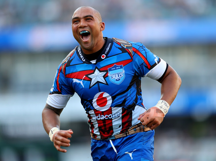 Cornal Hendricks celebrates after Jesse Kriel scored a try for the Vodacom Bulls during a Super Rugby match against the Cell C Sharks at Kingsmead Stadium in Durban on March 30 2019.