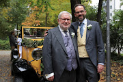 Former Benedictine monk Father Anselm Bilgri and his husband Markus pose for the media following their ecclesiastical same-gender marriage at Saint Willibrord church in Munich, Germany, October 8, 2022.