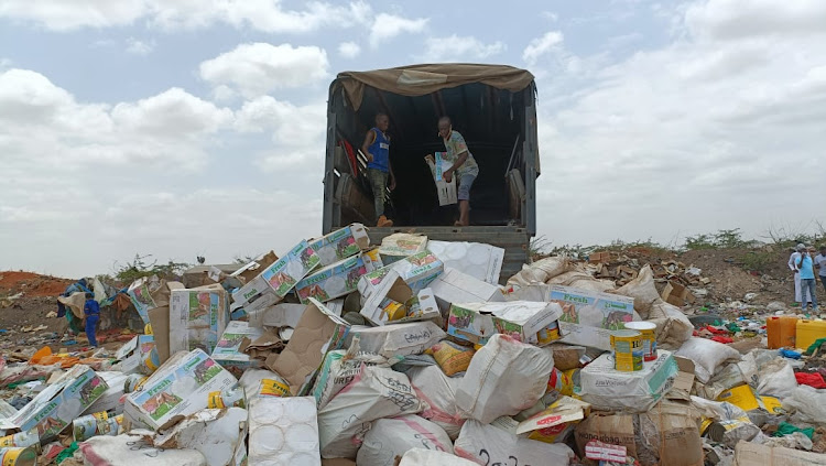 The contraband good being offloaded from a police track at the Garissa dump site on February 26.