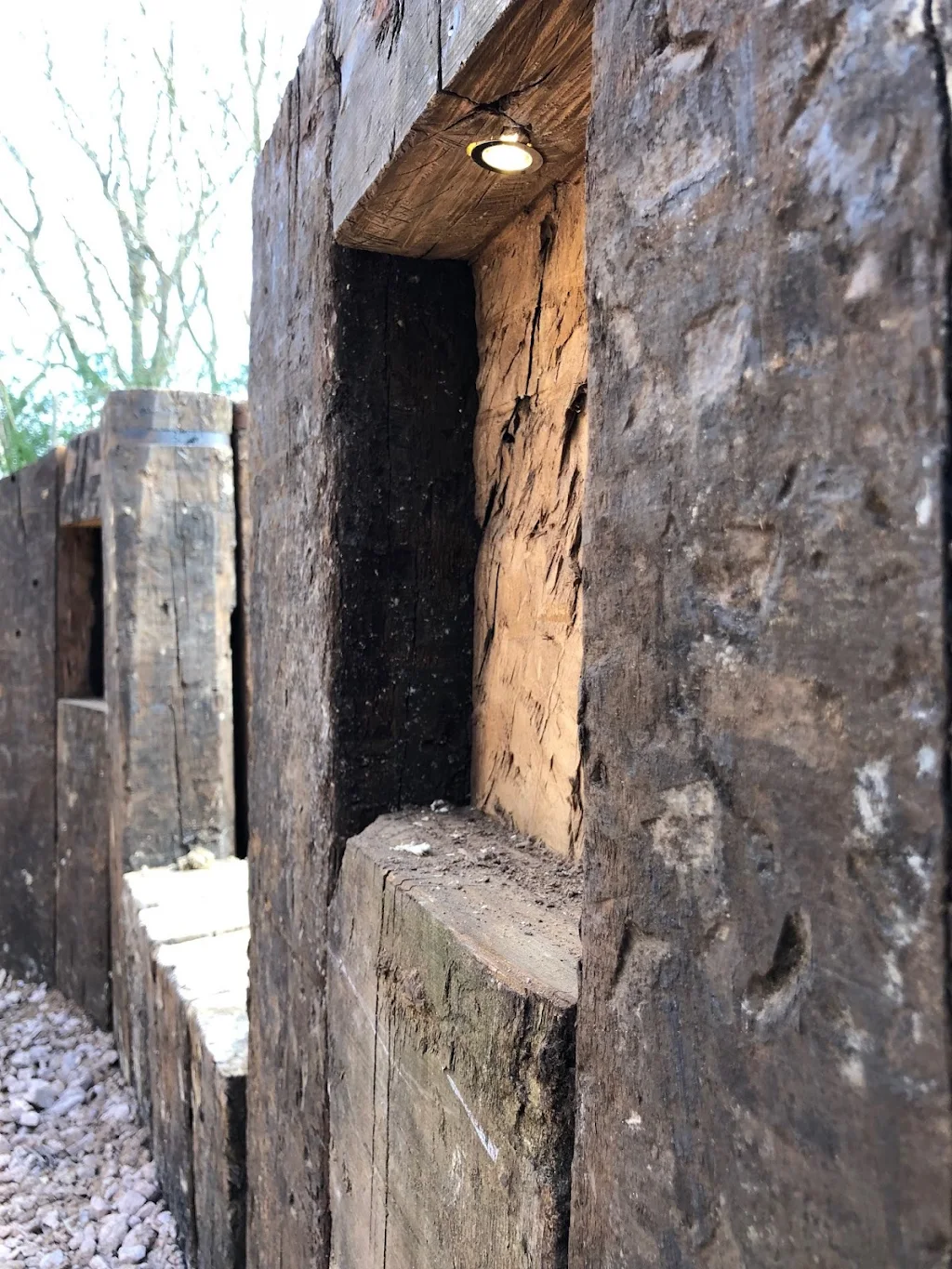 Mini spots added to alcoves created in garden retaining wall in Crowborough