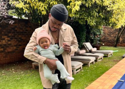 Proud dad Murdah Bongz with baby Asante.