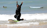 Annelissa Mhloli having fun surfing the waves.