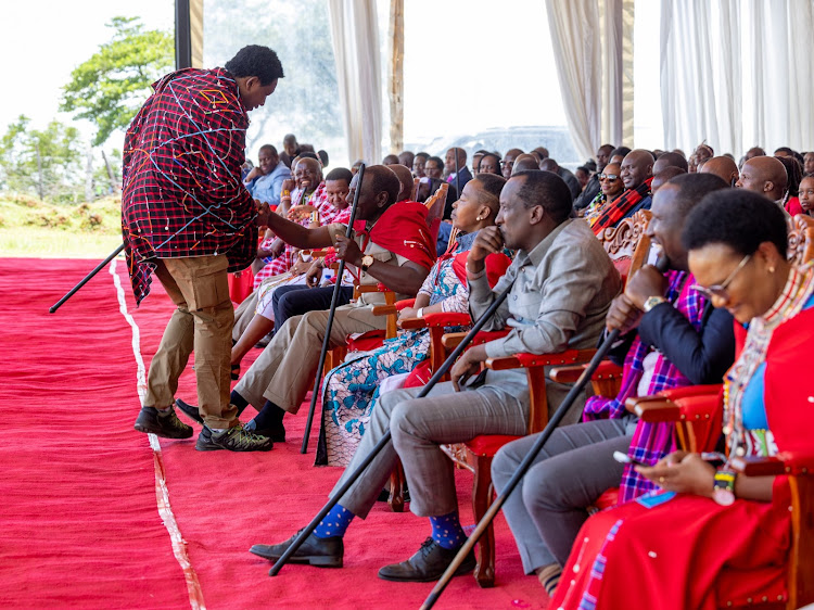 Narok Senator Ledama Ole Kina greeting President William Ruto during the interdenominational thanks giving service for Tourism PS John Ololtua held in Ildolisho Village in Kilgoris, Narok County on March 17, 2024