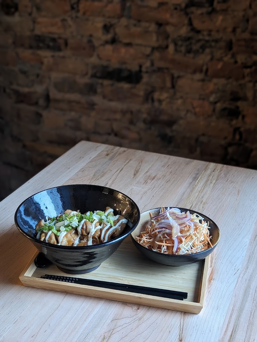 Chicken Teriyaki on Rice, topped with house-made mayo, scallion and shichimi togarashi (Japanese 7 spice seasoning). Comes with small salad. All made free of gluten.